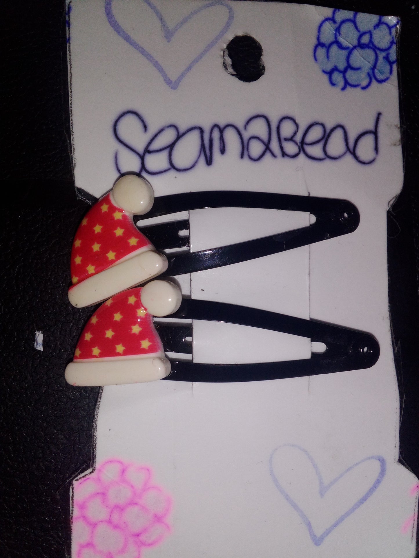 Two Santa hat with yellow star on it