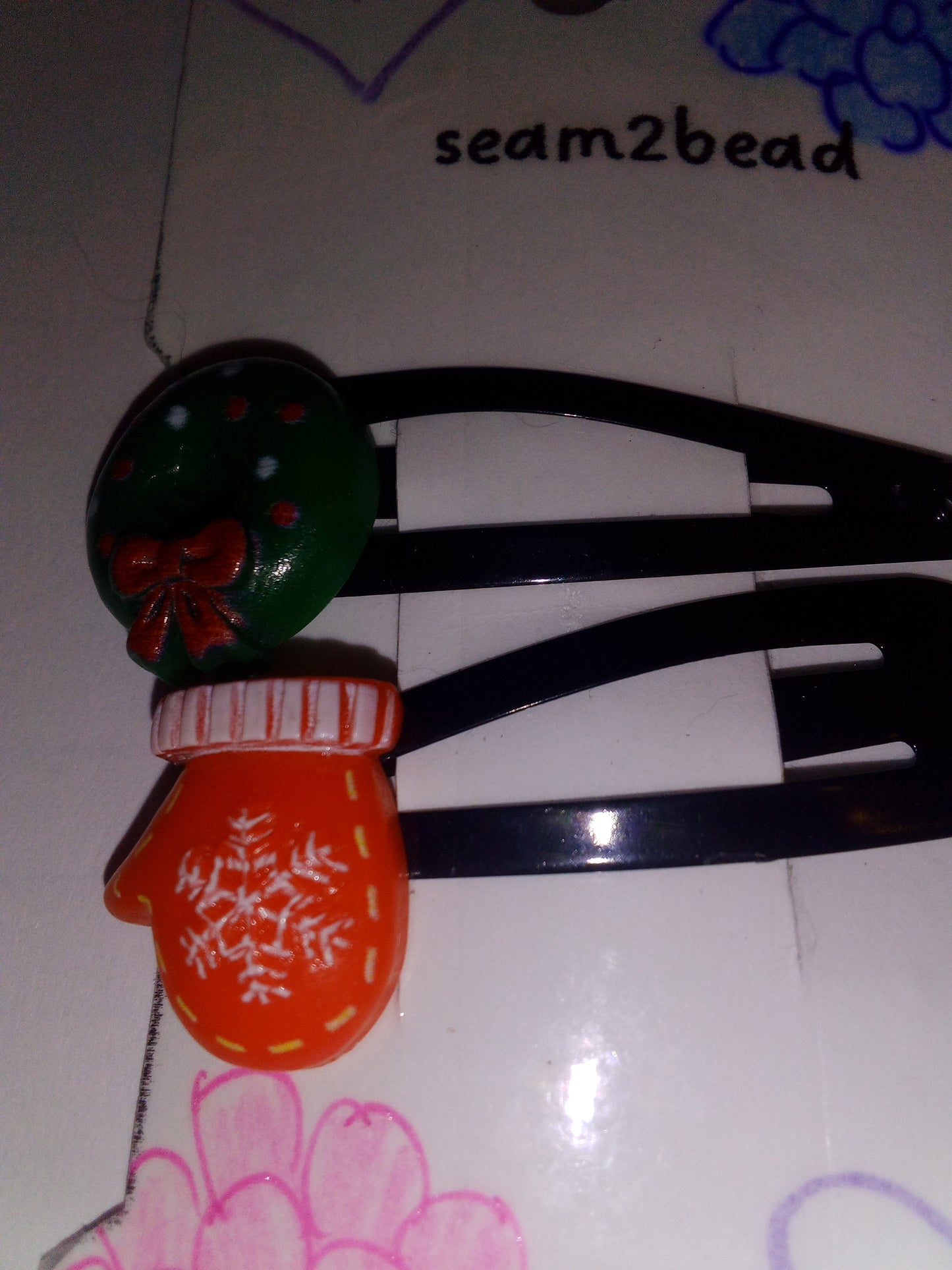 Green wreath with red stocking with a white snowflake