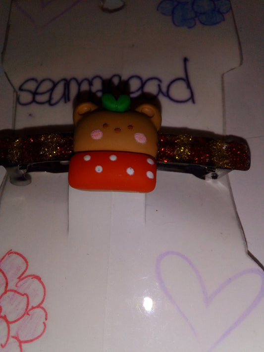 Red/ yellow glitter with (big) teddy bear