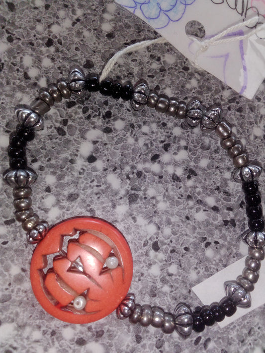 Dark gray seed beads black seed bead with sliver spacers with orange pumpkin