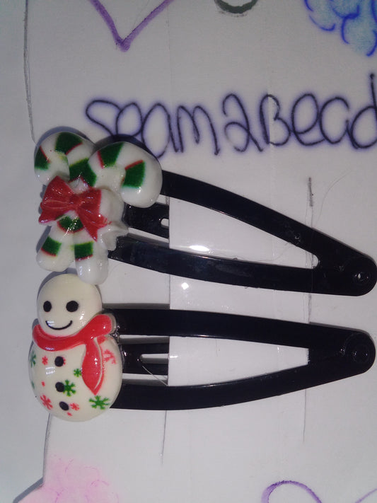 Two candy cane with snow man with red scarf