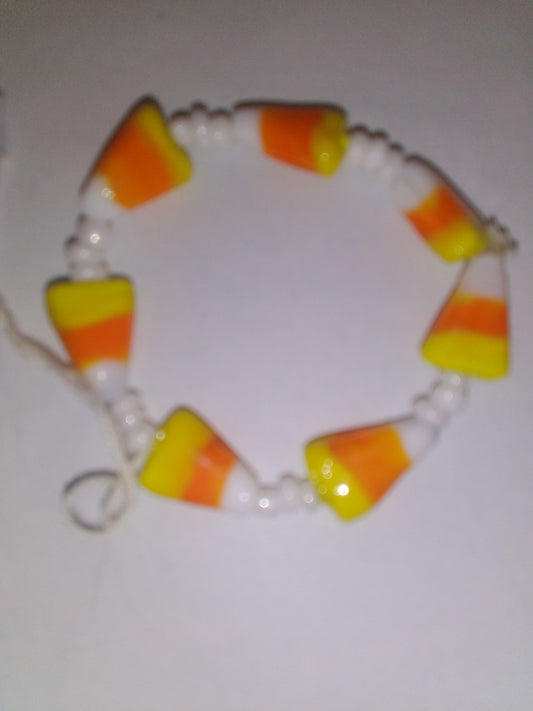 7 candy corn with white beads