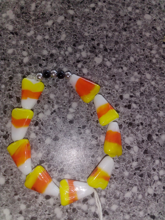 9 candy corn with 3 sliver/2 black spacer beads