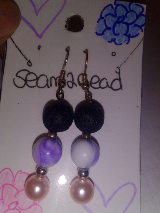 Black lava beads with purple swirls white marking gold spacer beads light pink pearl bead