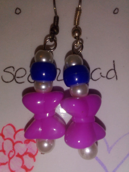 White pearl bead with blue bead with bright purple bow