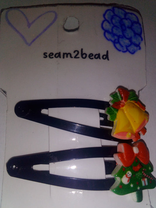 (2) bell with a Xmas tree with a red bow