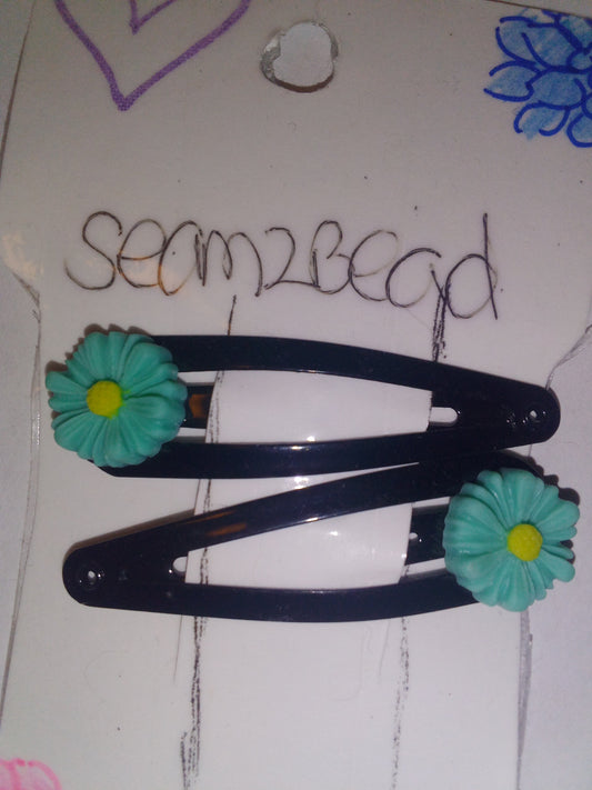 Teal flower with yellow middle hair clip