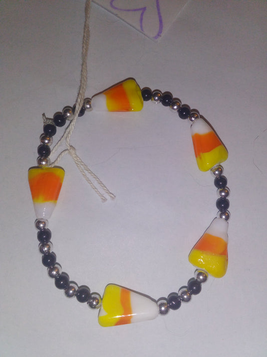 5 candy corn with black/sliver beads