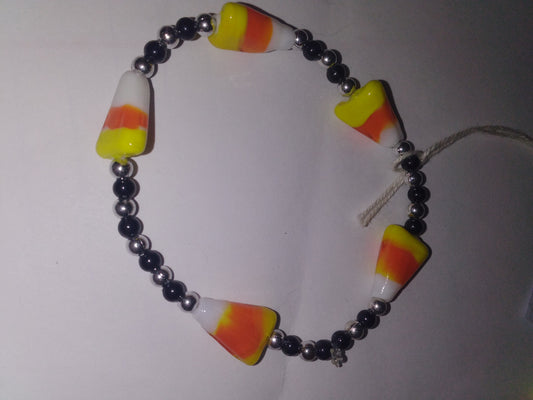 Candy corn with sliver and black beads