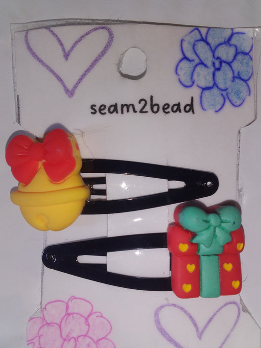 (big) yellow bell with red present with yellow heart with teal ribbon