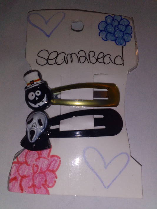 Black ghost with a white face with black skull face (yellow trim black hair clip