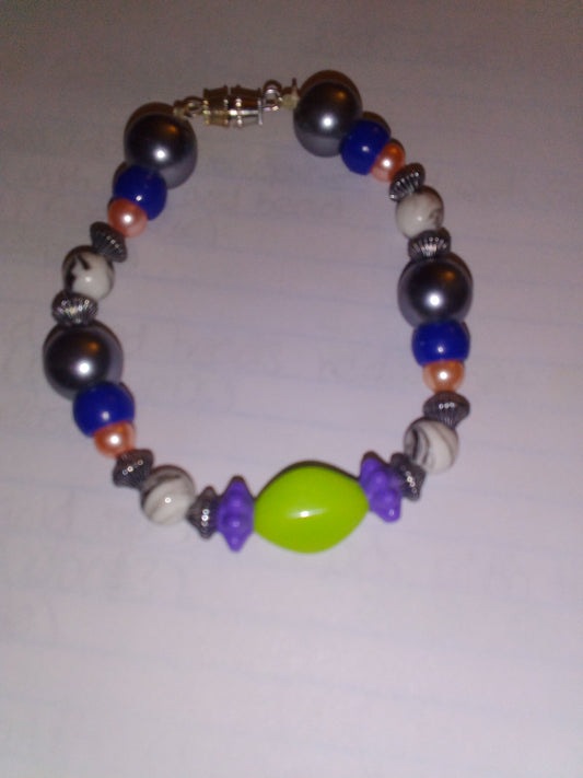 (big) sliver pearl bead with light pink pearl bead white with black drizzle line with blue bead sliver spacer purple flower and light green oval