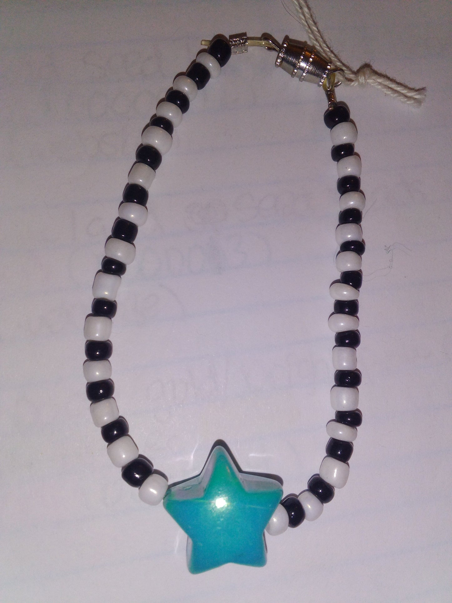 White/black seed bead with teal star bracelet