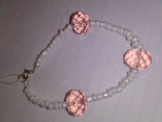 White seed beads with light pink crystal bead