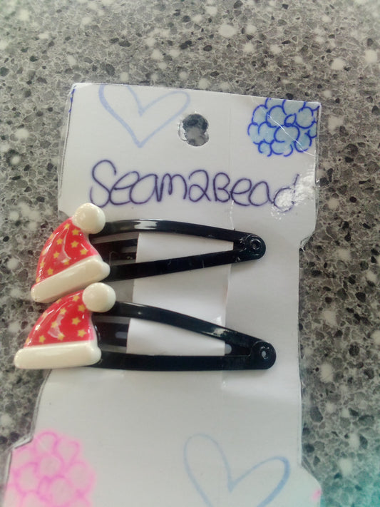 Two Santa hat with yellow stars